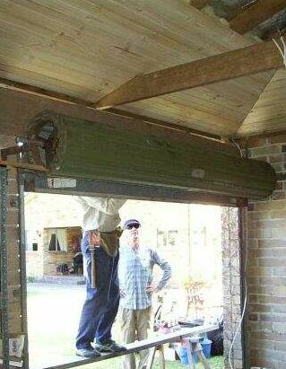 My friendly neighbour Ian working on the door; yours truly looking on